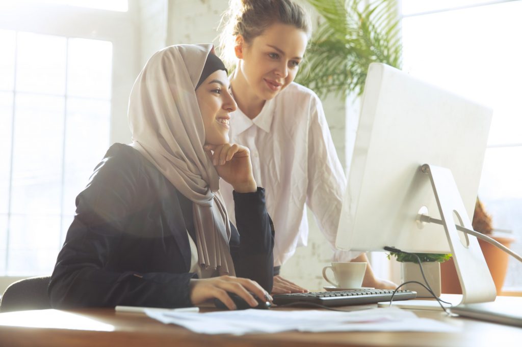 Portrait of a beautiful arabian businesswoman wearing hijab while working